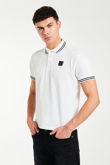 Model wearing a 'Relate' white men's polo shirt sale