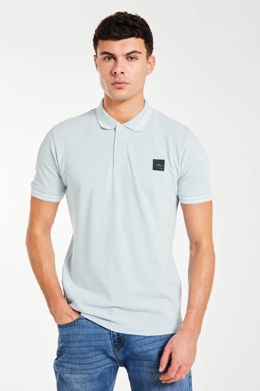 model wearing 'Relate' men's polo shirts sale in sky blue