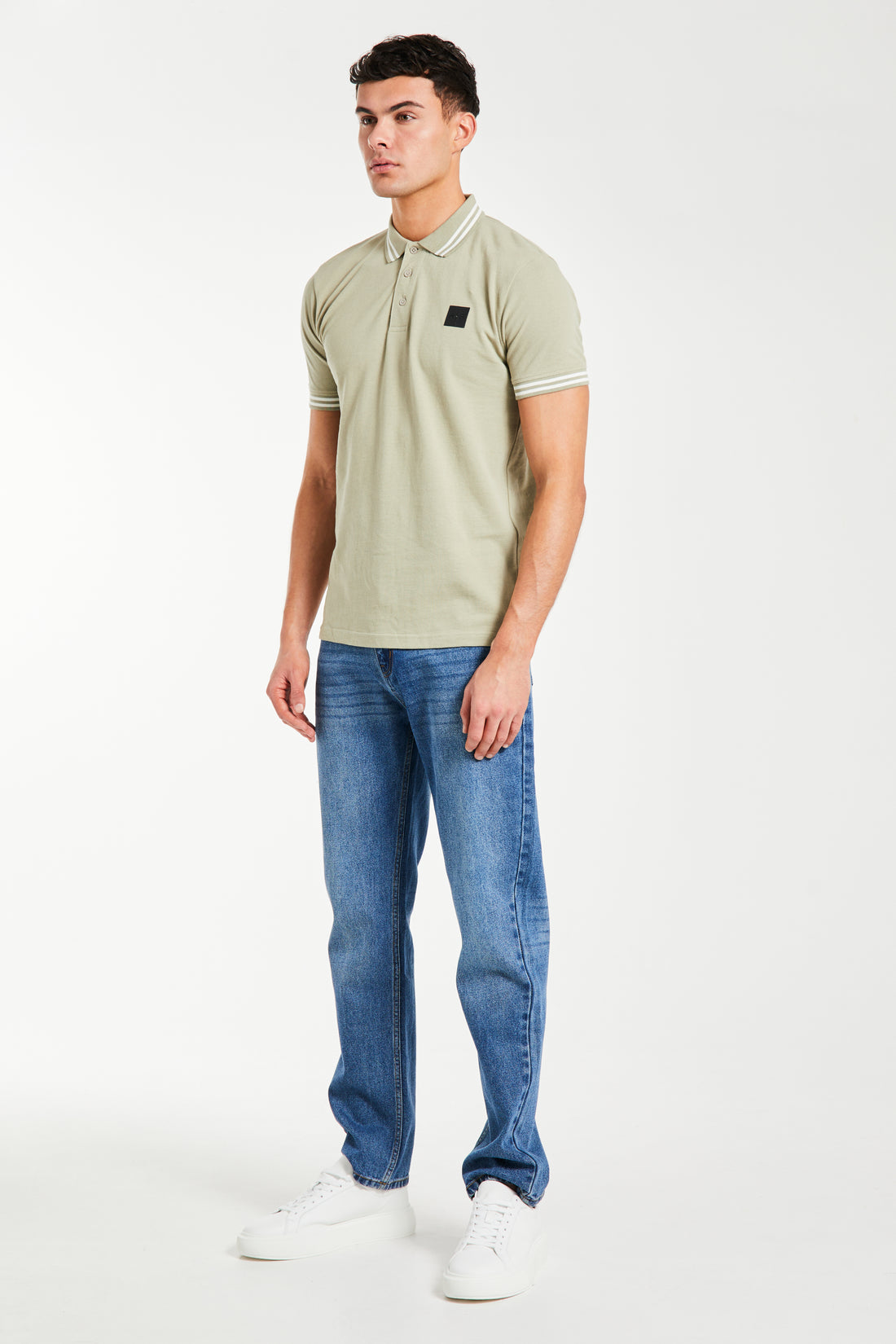 men's cheap polo shirts in green styled with jeans