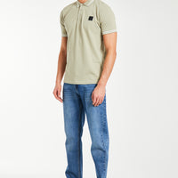 men's cheap polo shirts in green styled with jeans