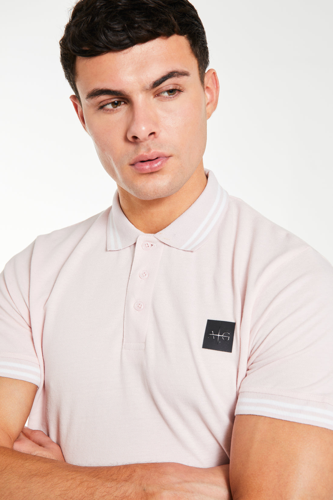 Close up of polos for men 'Avant Garde Paris' logo in dusty pink