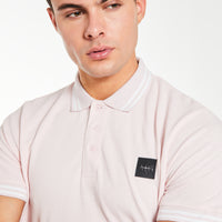 Close up of polos for men 'Avant Garde Paris' logo in dusty pink