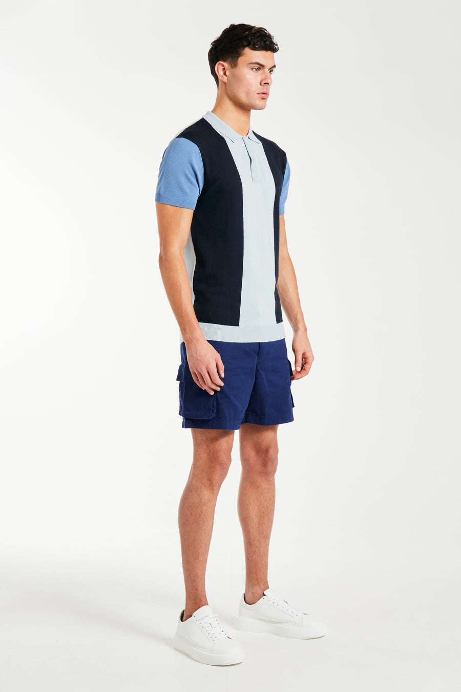 Men's knitted polo in three shades of blue paired with navy shorts