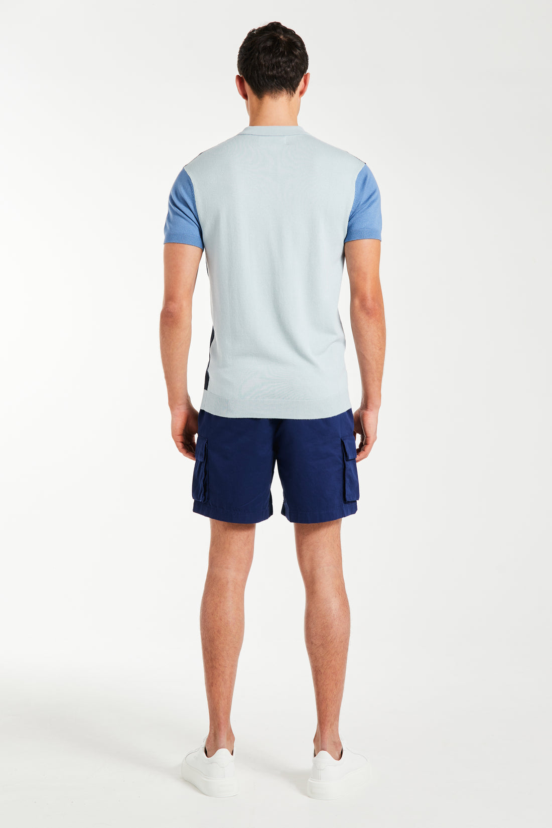 Back profile of blue men's knitted polo and shorts