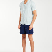 Short sleeve shirt for men in baby blue styled with shorts