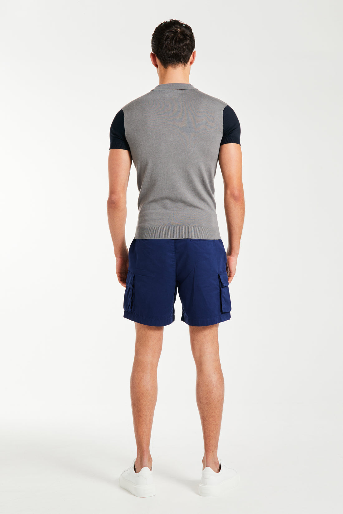 back profile of men's knitted polo in shade of grey