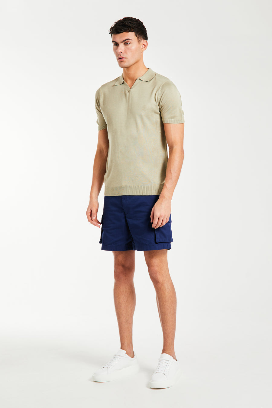 Beige v-neck men's knitted polo styled with shorts