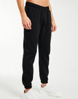 Blak joggers and white trainers (model shot)