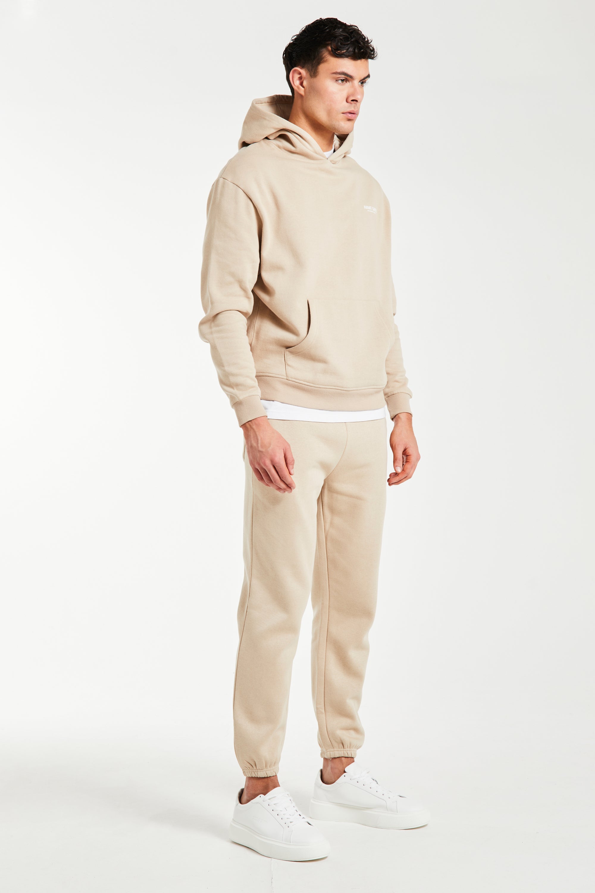 Side profile of mens taupe full tracksuit
