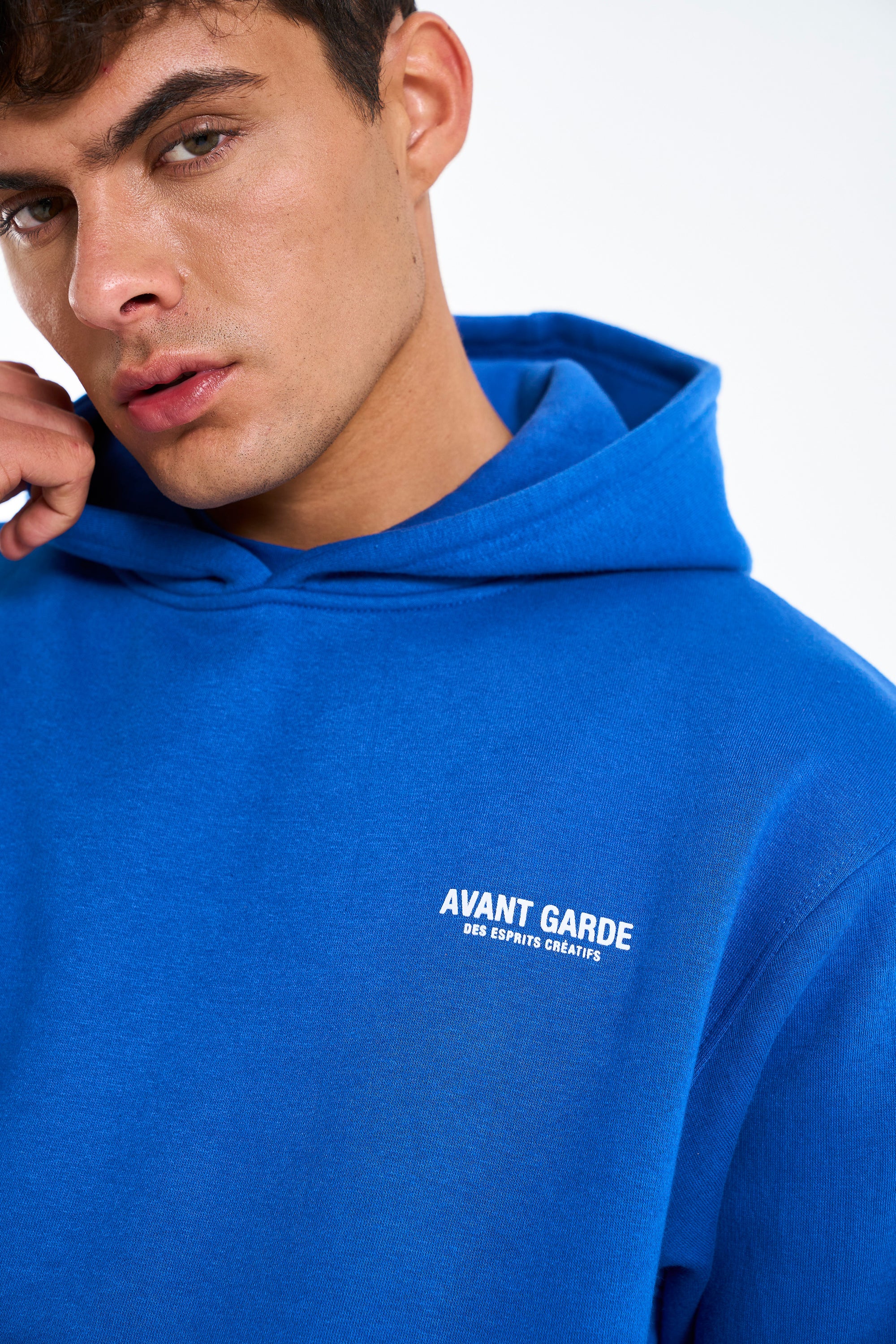 Small logo detail on royal blue hoodie