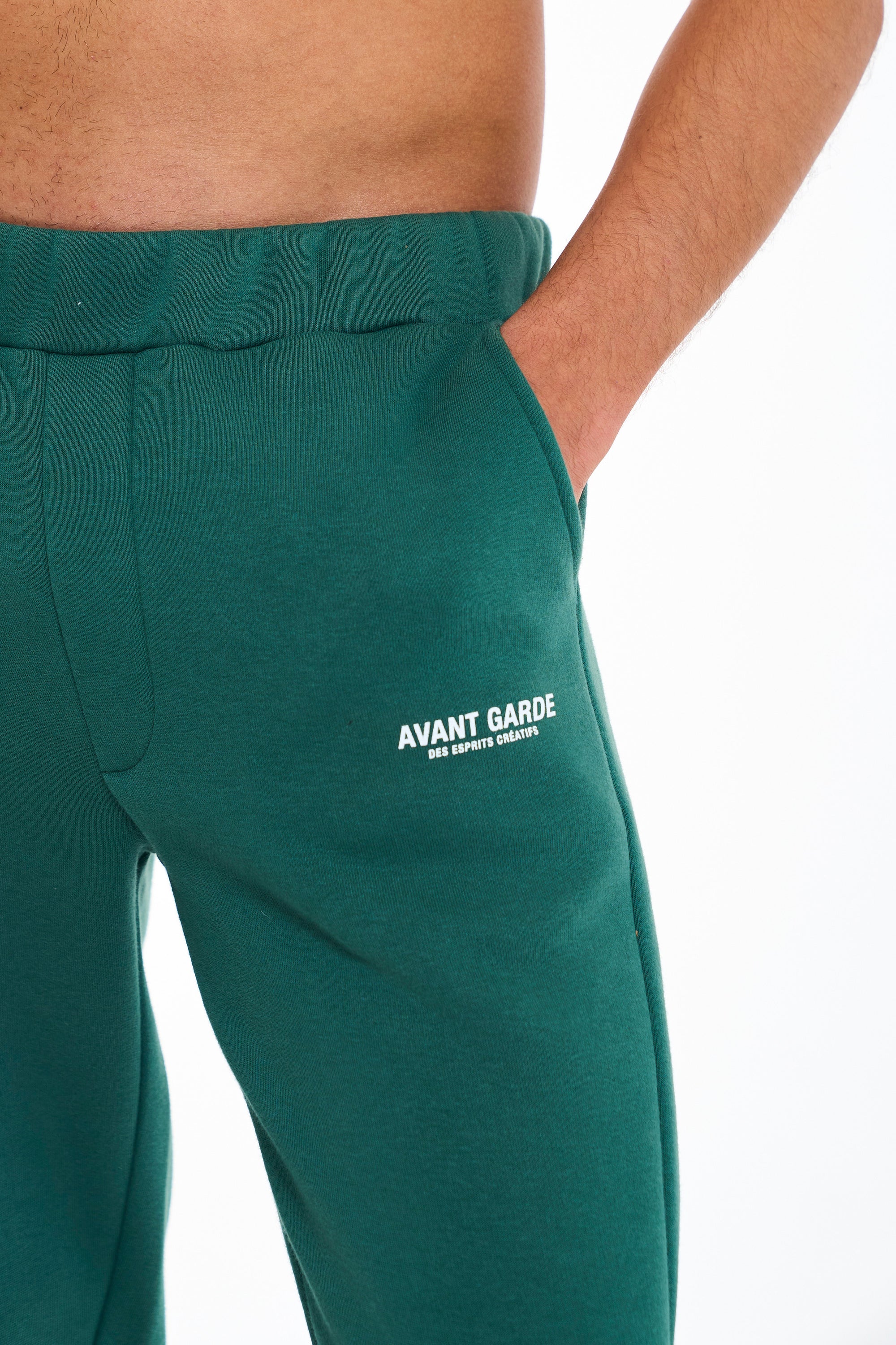 Logo detail on emerald green joggers