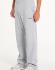 Men's tracksuit bottoms in grey with Avant Garde logo on upper leg