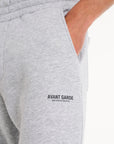Close up shot of Avant Garde logo on the leg of grey tracksuit bottoms