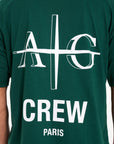 Back shot of Avant Garde crew neck T-shirt in green with large logo and CREW writing