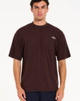 Front shot of male model wearing brown crew neck T-shirt
