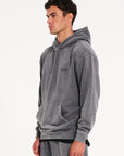 Model facing to the left wearing men's hoodie in steel