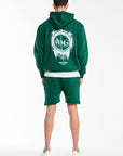 back profile of mens coord in green with logo on back
