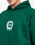 close up of emerald co ord sets men logo on chest
