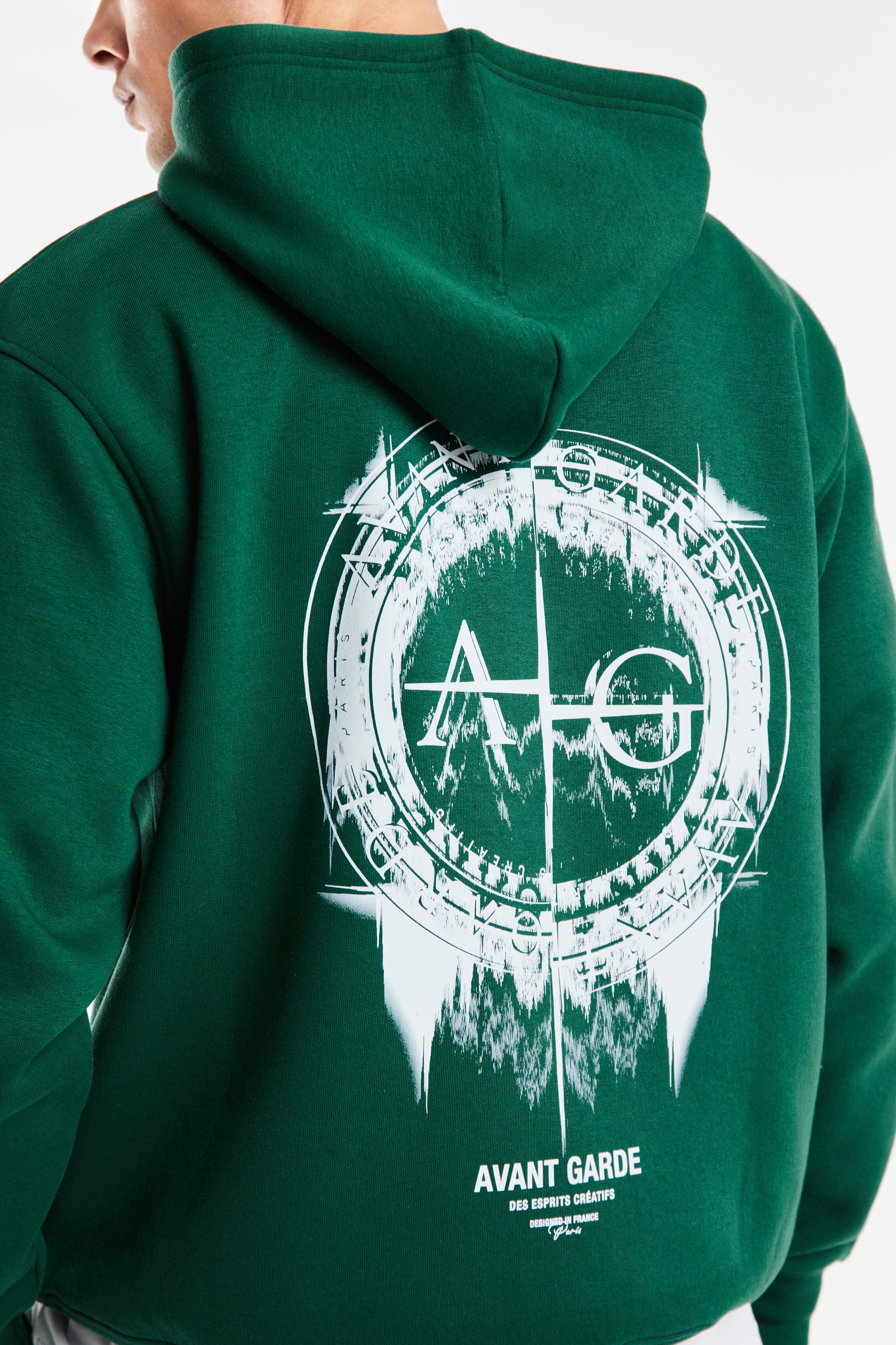 back profile of mens twin set hoodie in dark green with white 'Avant Garde' Logo