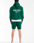 back profile of men's hoodies with 'avant garde' logo in dark green