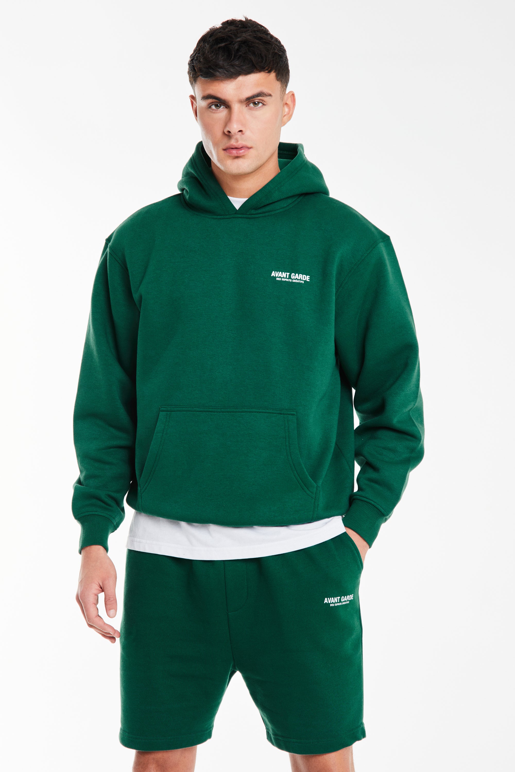 model wearing emerald green hoodie