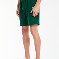 Model wearing dark green mens jersey shorts