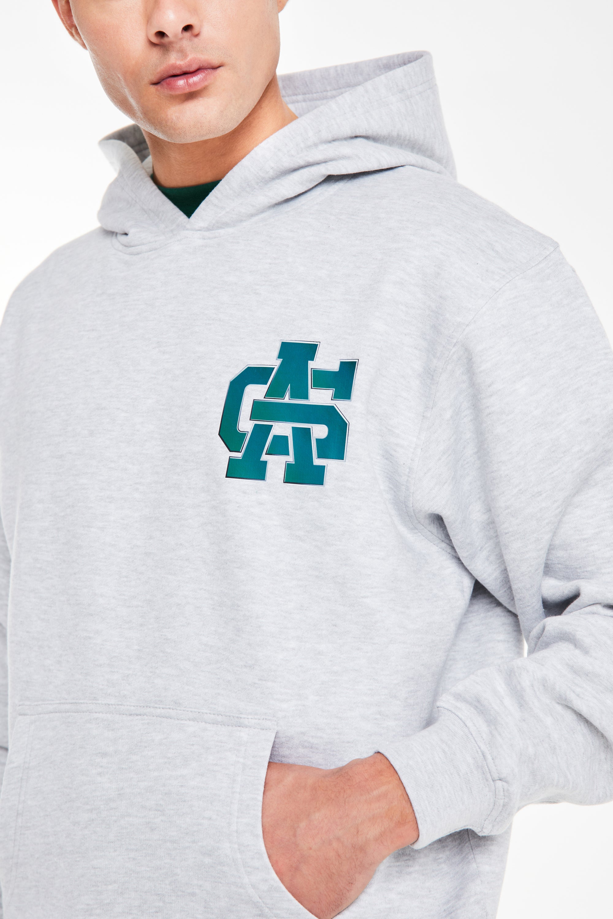 close up of 'avant garde paris' logo on chest on grey hoodie