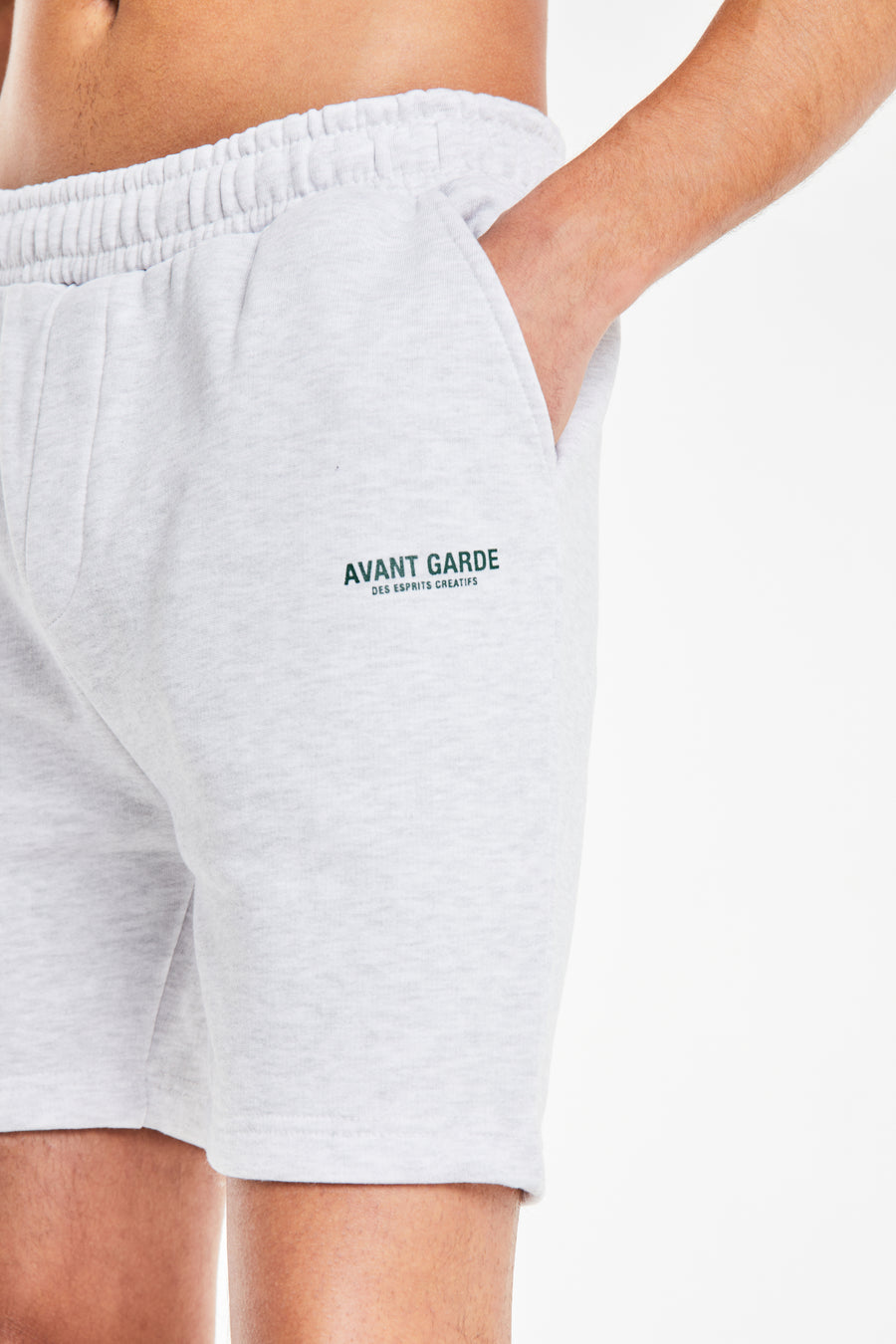close up of 'avant garde paris' logo on jersey shorts in grey