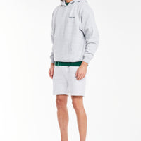model wearing light grey marl jersey shorts