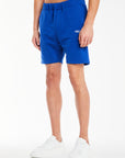 model wearing bright blue men's jersey shorts