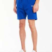 model wearing bright blue men's jersey shorts