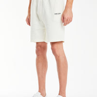 model wearing ecru 'creatives' jersey shorts for men