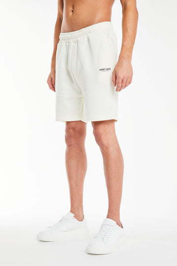 model wearing ecru 'creatives' jersey shorts for men