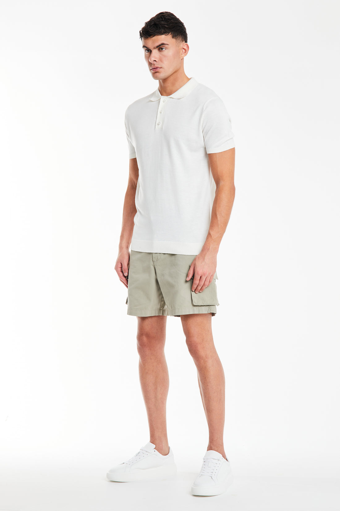 model wearing men's utility shorts with white polo