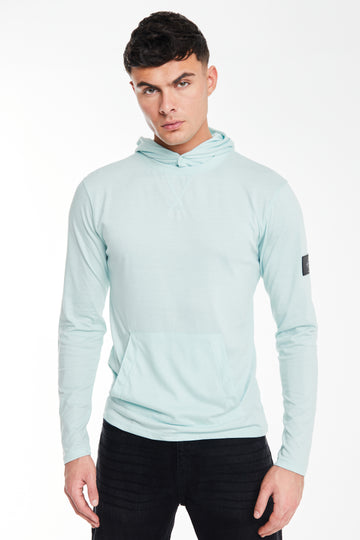 Model wearing 'Collusive' cheap hoodies in sky blue