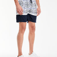 side profile of mens coords set shorts with a navy pattern 