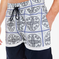 close up of men's co ord shorts in navy blue and white