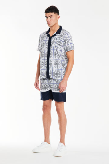 Model wearing 'Pont' men's twin set with a navy and white cool pattern on it