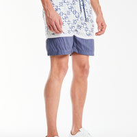 side profile of the shorts in a mens co ord with a baby blue pattern