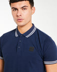 close up of blue polos for men with 'Avant Garde Paris' logo