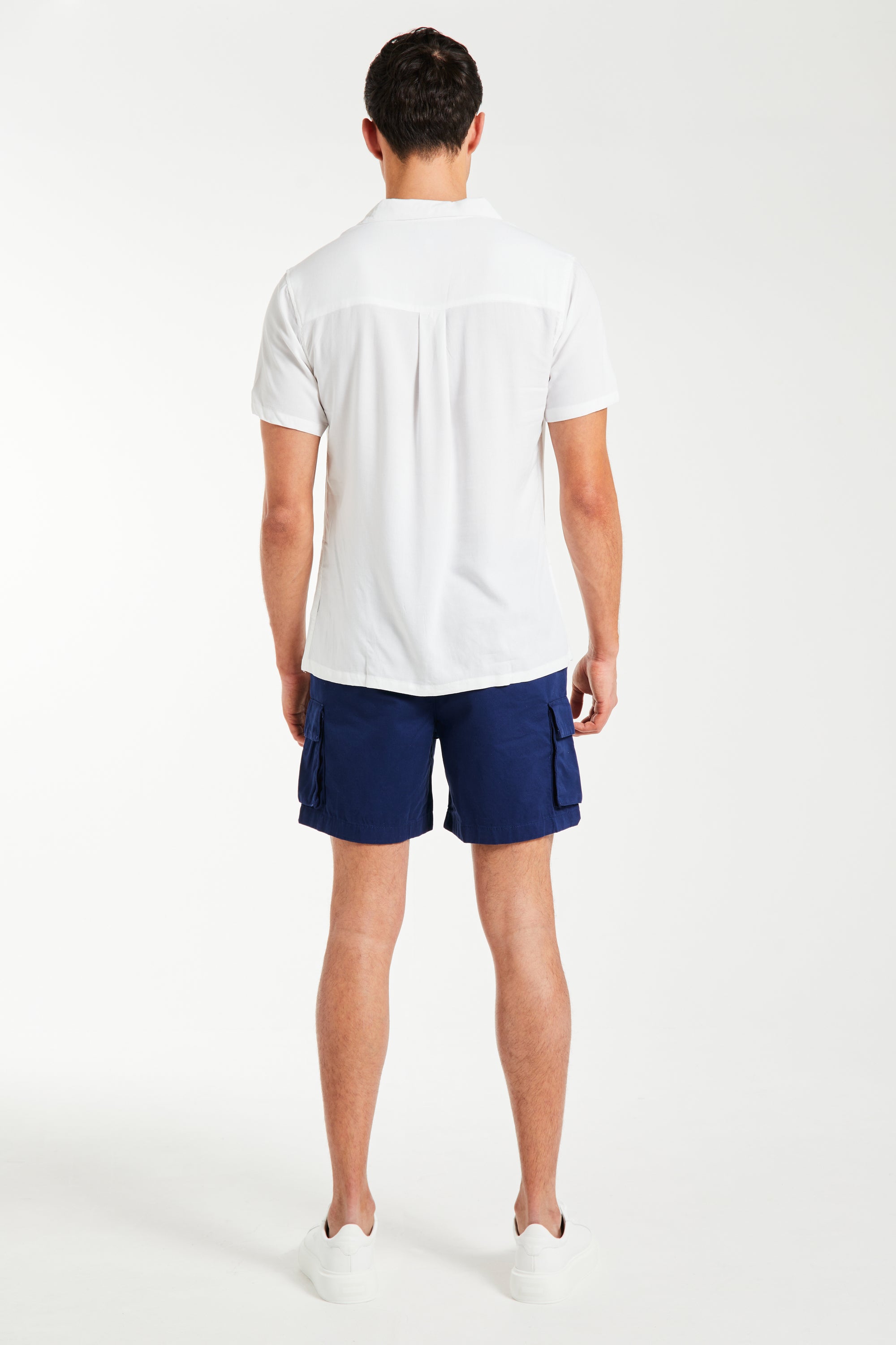 back profile of men&#39;s utility shorts in dark navy