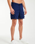 dark blue men's utility shorts paired with trainers