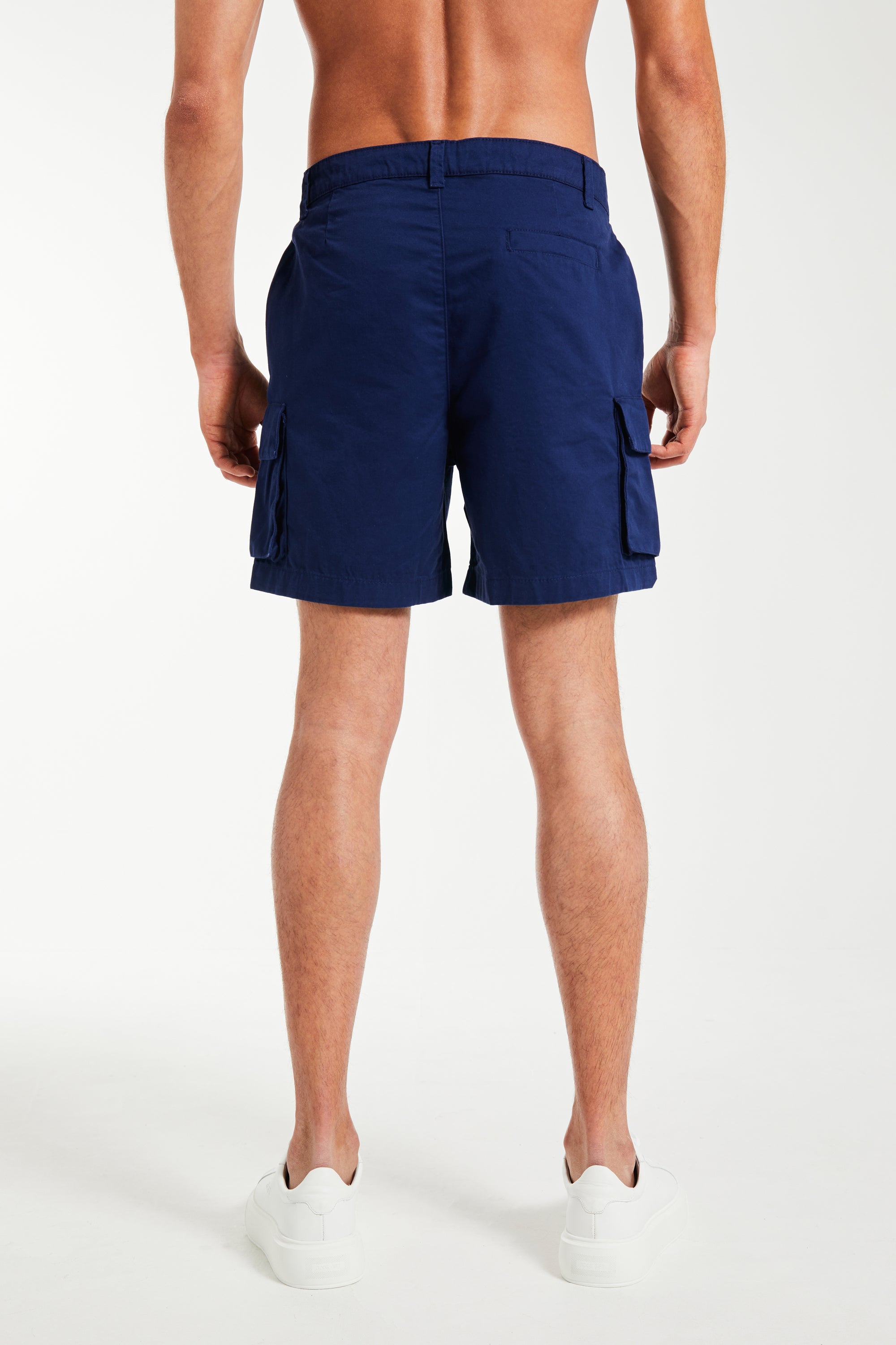 back profile of men&#39;s utility shorts in navy