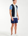 Men's knitted polo in three shades of blue paired with navy shorts