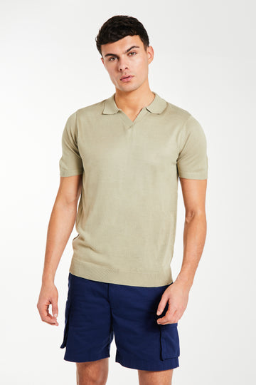 Model wearing v-neck knitted polo in oatmeal