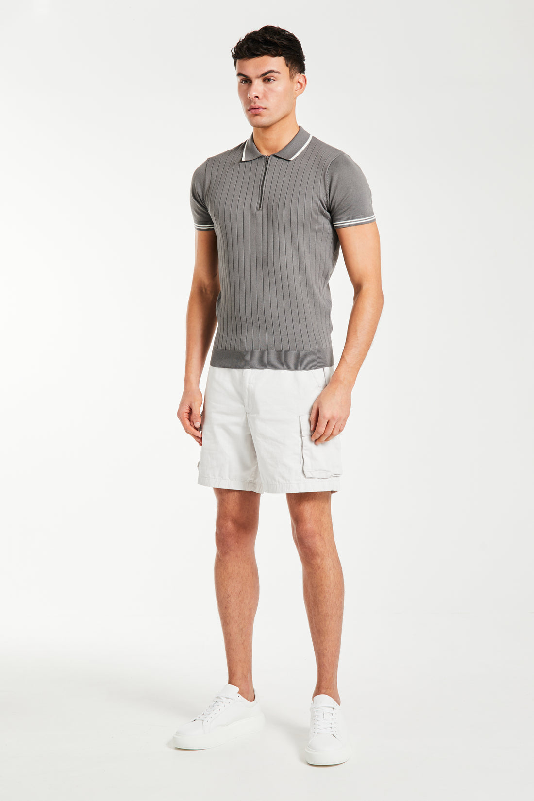 men's utility shorts in white paired with a grey polo