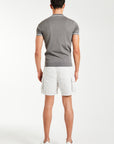 back profile of nimbus cloud men's utility shorts and a grey polo