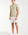 men's knitwear polo in beige styled with shorts