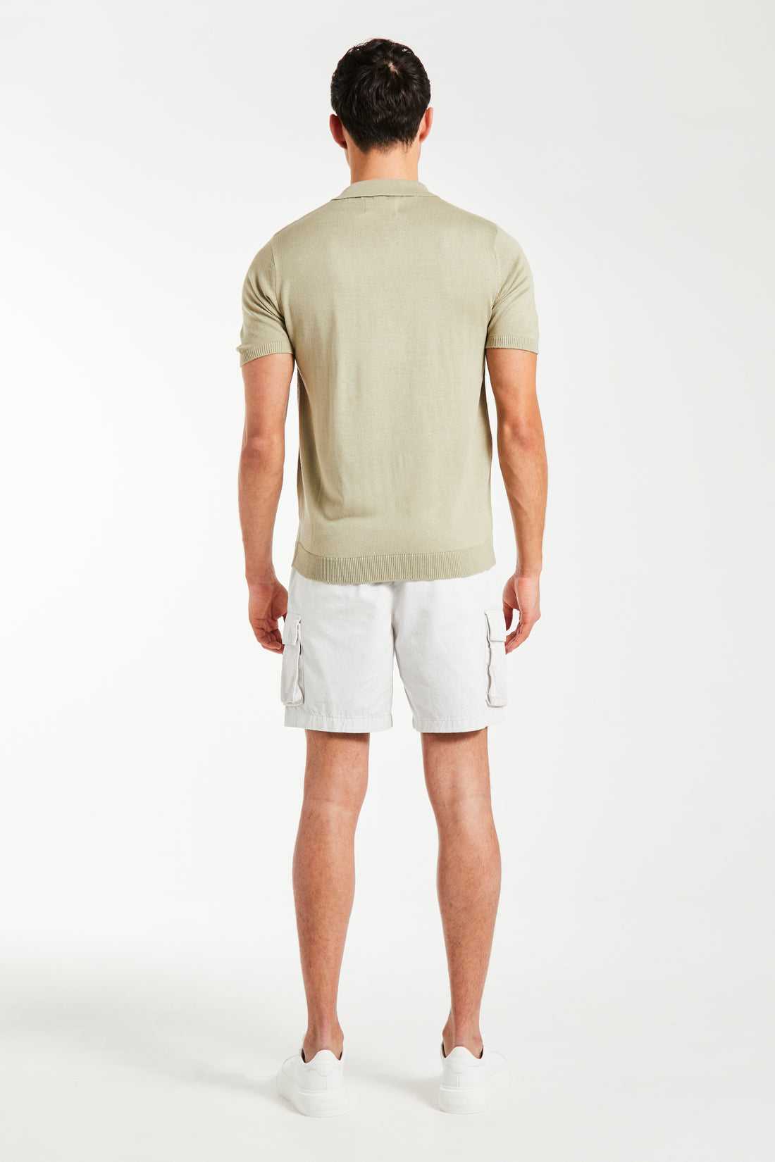 back profile of men's knitted polo in light beige