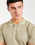 close up of men's button up knitted polo in oatmeal
